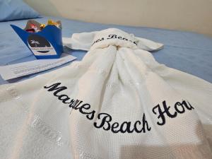 a white bag with the words missing beach show on it at Marques Beach House in Marechal Deodoro +9 photos