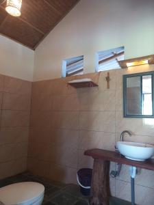 a bathroom with a sink and a toilet at Mai Chau Green house in Mai Châu