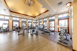 a gym with several treadmills and cardio machines at Marriott Ko olina beach club in Honokai Hale