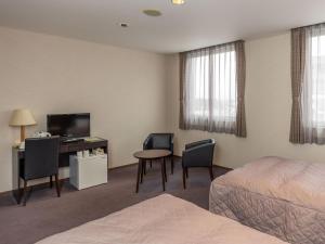 Postel nebo postele na pokoji v ubytování Hotel Epoka Tabist