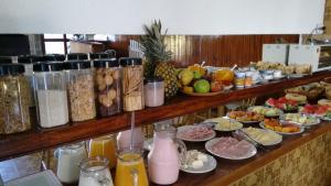 a buffet with many different types of breakfast foods at Villaggio di Roma in Campos do Jordão