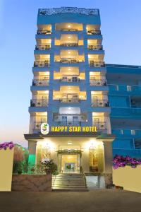 a hotel with a happy star hotel sign on it at Happy Star Hotel Nha Trang in Nha Trang