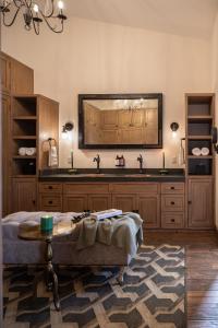 a kitchen with a sink and a table in a room at Private Jacuzzi & Pool, Elegant La Escondida 5BR in San Miguel de Allende