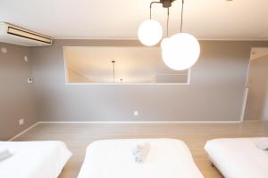 Una cama o camas en una habitación de Hoshizora no Yado -SEVEN Hotels and Resorts- 11 fotos más