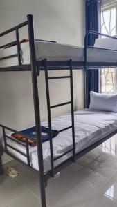 a couple of bunk beds in a room at GreenLake Vista in Surabaya