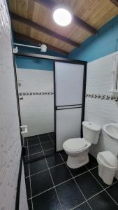 a bathroom with two toilets in a room at Cabaña rodeada de naturaleza in Cocorná +26 photos