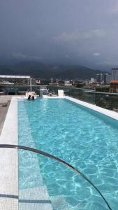 a large blue swimming pool on top of a building at Best View in Marina puerto Vallarta in Puerto Vallarta
