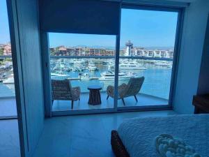 a bedroom with a view of a harbor with boats at Best View in Marina puerto Vallarta in Puerto Vallarta +24 photos
