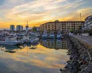 a group of boats docked in a marina at sunset at Best View in Marina puerto Vallarta in Puerto Vallarta