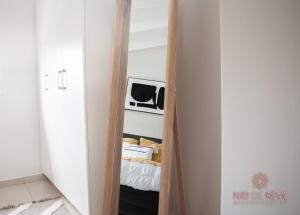 a closet with a mirror in a room at Nid de Rêve Accomodation in Sandton