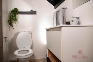 a bathroom with a toilet and a sink at Nid de Rêve Accomodation in Sandton
