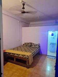Säng eller sängar i ett rum på Laxmi Guest House (Arambol Beach)