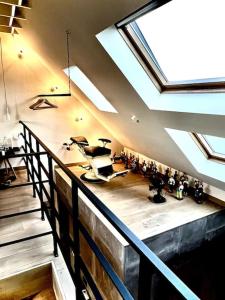 an attic room with a gym with a skylight at Agelandkaai (.be) Free Parking in Ghent