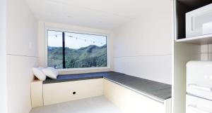 a window seat in a kitchen with a mountain view at Starium Jecheon in Jecheon