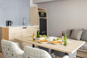 a kitchen with a table with two plates of food at Tokyu Stay Shibuya in Tokyo