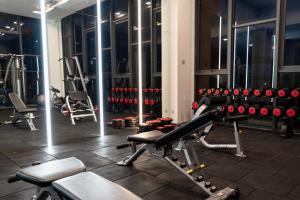 a gym with a lot of exercise equipment at K Avenue 4-5 Pax Near KKIA Family Room (B) in Penampang