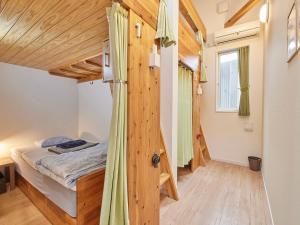 Postel nebo postele na pokoji v ubytování Itosima Guesthouse TOMO