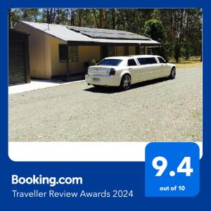 a white car parked in front of a house at Bronte Lodge, Wine Country Stay Hunter Valley with Games Room, Close to Town in Greta Main