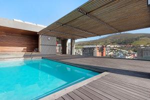 a swimming pool on the roof of a building at Neighbourgood Loop Street in Cape Town