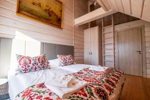 En eller flere senge i et værelse på City Lights Zakopane