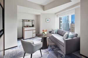 a living room with a couch and a table at ANA InterContinental Tokyo by IHG in Tokyo