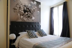 Rúm í herbergi á Hôtel Princesse Isabelle