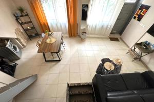 an overhead view of a living room with a couch and a table at Les Platanes in Cassis