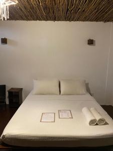 מיטה או מיטות בחדר ב-Boracay Coco Huts
