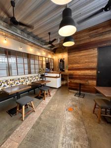 a conference room with wooden walls and tables and chairs at Urban Boutique Hotel in Boracay