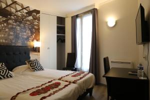 Ένα ή περισσότερα κρεβάτια σε δωμάτιο στο Hôtel Princesse Isabelle