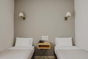 Llit o llits en una habitació de Messini Hotel