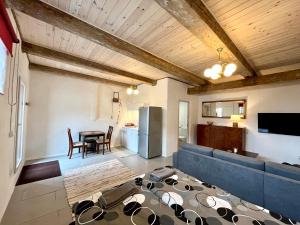 a living room with a couch and a table at Valgeranna Apartment in Pärnu