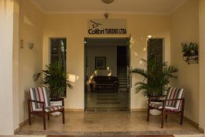 a lobby with two chairs and a sign that reads colonial museum at Pousada Cataratas in Foz do Iguaçu +88 photos