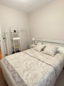a bedroom with a bed and a ladder in it at Apartamento Ideal in Mundaka