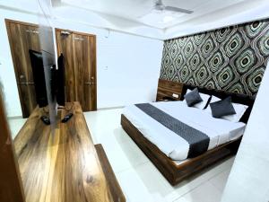 Katil atau katil-katil dalam bilik di HOTEL TAPOVAN IN