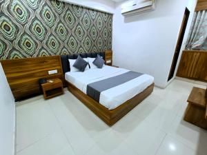 Katil atau katil-katil dalam bilik di HOTEL TAPOVAN IN