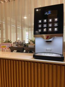 a computer monitor sitting on top of a counter at Ayothaya Hotel in Phra Nakhon Si Ayutthaya