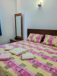 Postel nebo postele na pokoji v ubytování Shalom Villa