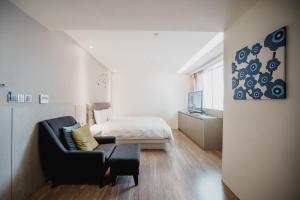 Postel nebo postele na pokoji v ubytování Hub Hotel Kaohsiung Yawan Branch