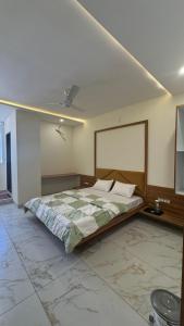 Postel nebo postele na pokoji v ubytování Hotel Prakasham