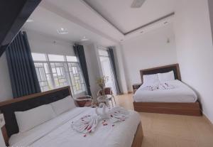 Postel nebo postele na pokoji v ubytování Phuong Vy Hotel