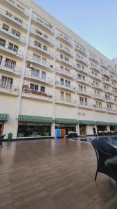 a large apartment building with a large courtyard at ARMERIA STAY 309 in Lucknow +8 photos