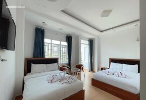 Postel nebo postele na pokoji v ubytování Phuong Vy Hotel