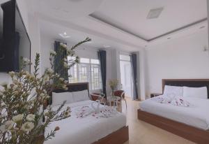 Postel nebo postele na pokoji v ubytování Phuong Vy Hotel