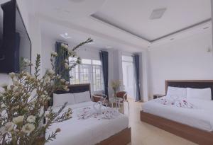 Postel nebo postele na pokoji v ubytování Phuong Vy Hotel