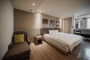 Postel nebo postele na pokoji v ubytování Hub Hotel Kaohsiung Yawan Branch