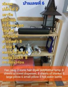a sign on a shelf with a light on it at Classic Home Stay Hatyai in Ban Tha Sae