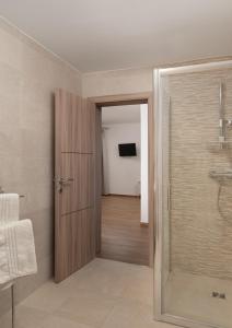a bathroom with a shower and a glass door at Villa Oliva - Adriatic Luxury Villas in Murvica