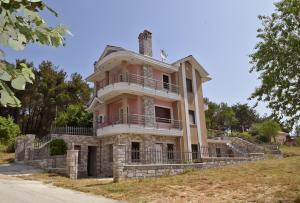 an old house on the side of a hill at Villa Spiros in Ioannina