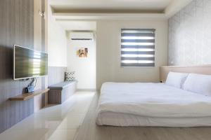Postel nebo postele na pokoji v ubytování Jialai Homestay